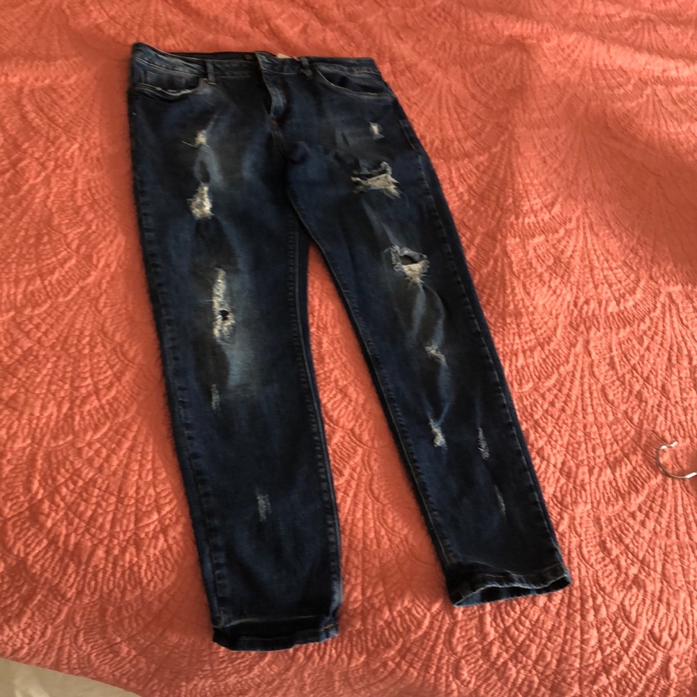 Jeans. Trousers. Denim with holes